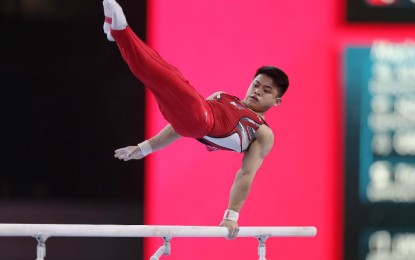 <p><strong>TOKYO OLYMPICS QUALIFIER</strong>. Carlos Edriel Yulo does a difficult routine on the parallel bars of the all-around qualifiers in the 49th FIG Artistic Gymnastics World Championships Monday at the Hans Martin Schleyer Halle in Stuttgart, Germany on Monday (Oct. 7, 2019). Yulo secured a slot in the 2020 Tokyo Olympic Games after advancing to the men’s all-around finals. <em>(Photo courtesy of Janet Tenorio)</em></p>