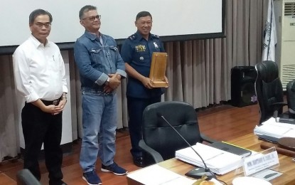<p><strong>RECOGNIZED.</strong> Brig. Gen. Ernesto V. Flores (right), the deputy regional director for administration of Police Regional Office-Caraga, receives the plaque recognition from NEDA-Caraga Regional Director Bonifacio Uy (left) and Agusan del Sur Governor Santiago Cane, Jr. during the council's 4th Quarter Meeting on Tuesday (Oct. 8, 2019). The plaque recognizes the development contributions of former PRO-Caraga Director Brig. Gen. Gilberto DC Cruz to Caraga Region.<em> (PNA photo by Alexander Lopez)</em></p>