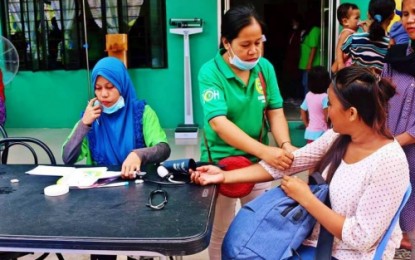 <p><strong>SERVICING THE INDIGENTS.</strong> Health ministry workers of the Bangsamoro Autonomous in Muslim Mindanao attends to a member of the indigenous peoples (IPs) during an outreach mission in Datu Blah Sinsuat, Maguindanao on Wednesday (Oct. 9. 2019). Similar programs are set to take place in chosen IP areas across the BARMM during the celebration of IPs month this October. <em>(Photo courtesy of MIPA-BARMM)</em></p>