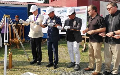 <p><strong>TRAINING HUB VS. TERRORISM</strong>. Philippine National Police chief Police Gen. Oscar Albayalde (4th from right) join US officials led by Ambassador to the Philippines Sung Kim (5th from right) and a representative from the Department of Foreign Affairs in the ceremonial lowering of a time capsule during the groundbreaking ceremony of the first-ever, state-of-the-art Regional Counterterrorism Training Center (RCTTC) in the Philippines held at Camp General Mariano Castañeda, Silang, Cavite on Friday (Oct. 11). The RCCTC will train Filipino law enforcement personnel on counter-terrorism operations and strengthen the regional security relationship and cooperation between the Philippines and East Asia Pacific partners nations-- Indonesia, Thailand, and Malaysia.  <em>(PNA photo by Gladys S. Pino)</em></p>