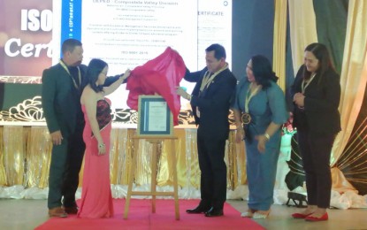 <p><strong>ISO-CERTIFIED.</strong> Officials of the Department of Education in Compostela Valley Province Division unveil the ISO Certification plaque on Friday (October 11) during an event in Tagum City, Davao del Norte. DepEd-Compostela Valley Province Division is the first division office in Davao Region to receive an ISO certification. <em>(Contributed photo)</em></p>
