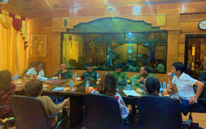 <p><strong>BOUNTY UP.</strong> Mayor Sumulong Sultan (sitting extreme right) of Pikit, North Cotabato, presides over Friday's (Oct. 11) municipal peace and order council meeting where members agreed to raise a PHP200,000 reward for information leading to arrest of suspects behind the recent murder of a Pikit village councilman and two others. The town has been rocked by a series of killings lately. <em>(Photo courtesy of Pikit Mayor’s Office)</em></p>