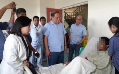 <p><strong>SEEKING JUSTICE.</strong> Marikina Mayor Marcelino "Marcy" Teodoro on Monday (Oct. 14, 2019) visits Lauro Legarde who was shot in the stomach by a Marikina cop last week in an alleged gun scuffle. The mayor also vowed an impartial probe on the killing of Lagarde's friend, Kim Lester Ramos, who died after being shot in the head during the incident. <em>(Photo courtesy of Marikina PIO)</em></p>