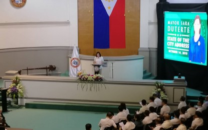 <p><strong>SOCA 2019</strong>. Mayor Sara Z. Duterte delivers her State of the City Address (SOCA) at the Sangguniang Panlungsod in Davao City on Monday (October 14). She highlighted the growth of investments in the city and the three-year accomplishments under the ‘Byaheng Do30’ project which she said have ‘capped a healthy economy’. <em>(PNA photo by Che Palicte)</em></p>