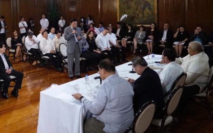 <p><strong>MEETING.</strong> Officials of the League of Cities of the Philippines, led by national president Bacolod City Mayor Evelio Leonardia (partially seen seated front, left), and the League of Provinces of the Philippines, headed by Marinduque Gov. Presbitero Velasco Jr. (standing, front), meet President Rodrigo Duterte and his Cabinet secretaries in Malacañang Palace last Friday (October 11, 2019). They discussed the release of the expanded Internal Revenue Allotment share of local government units. (Photo courtesy of Bacolod City PIO)</p>