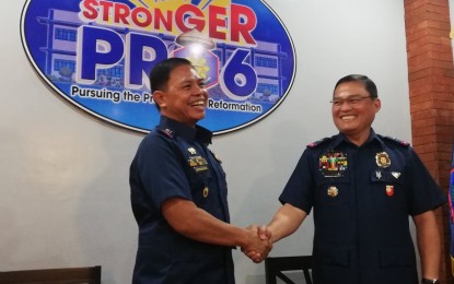 <p><strong>NEW ASSIGNMENT.</strong> Lt. Col. Jovie Espenido (left) is welcomed to the Police Regional Office 6 (Western Visayas) by Brig. Gen. Rene Pamuspusan, PRO-6 regional director at Camp Delgado, Iloilo City on Wednesday (Oct. 16, 2019). Espenido was assigned as the deputy city director for operations of the Bacolod City Police Office effective Wednesday. <em>(PNA photo by Gail Momblan)</em></p>