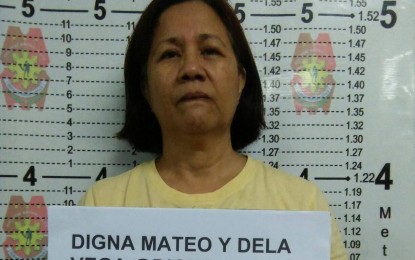 <p><strong>ARRESTED.</strong> Digna Mateo, a former officer of the New People's Army, was arrested inside the Our Lady of Fatima Parish Church in Meralco Village, Barangay Lias, Marilao, Bulacan on Wednesday (Oct. 16, 2019). Mateo is included in the police's Periodic Status Report on Threat Groups in 2019. <em>(Photo courtesy of the Bulacan Police Provincial Office)</em></p>