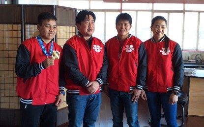 <p><strong>CARDINAL PRIDE</strong>. Amateur International Boxing Association (AIBA) World Women’s Boxing Championship gold medalist Nesthy Petecio (left) poses with the University of Baguio president Javier Bautista (2nd from left) along with fellow national team members Irish Magno (3rd from left) and Ira Villegas during a courtesy call Friday. Petecio is a University of Baguio student taking up Tourism and Hotel Management. <em>(PNA photo by Pigeon Lobien)</em></p>