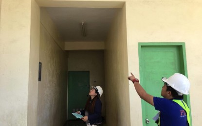 <p><strong>QUAKE RESPONSE.</strong> Engineers of the Department of Public Works and Highways - South Cotabato 2nd District Engineering Office inspect a building at the Baluan National High School in General Santos City on Thursday (Oct. 17, 2019). The inspection was in line with the strong earthquake that jolted the city and other parts of Mindanao on Wednesday night. <em>(Photo courtesy of DPWH-Soccsksargen)</em></p>