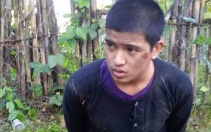 <p><strong>ESCAPEE.</strong> Aljon Cardenas, New People Army (NPA) rebel, arrested by police officers after a failed attack on Victoria, Northern Samar police station. He escaped from the sub-provincial jail in Allen, Northern Samar on Thursday (Oct. 17, 2019). <em>(Photo courtesy of Philippine National Police)</em></p>