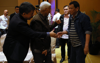 <p><strong>RESPECTED STATESMAN.</strong> President Rodrigo Roa Duterte greets Senate President Aquilino 'Koko' Pimentel III and former Senator Aquilino 'Nene' Pimentel Jr. prior to the start of the meeting with officials from the Partido Demokratiko Pilipino-Lakas ng Bayan (PDP-Laban) at the Diamond Hotel in Manila on August 9, 2018. Joining the President is Sec. Bong Go of the Office of the Special Assistant to the President. <em>(Presidential photo)</em></p>