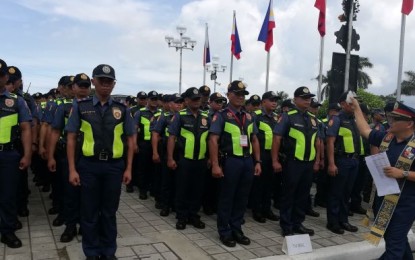 <p><strong>MASSKARA SECURITY</strong>. Lt. Col. Gilbert Ilagan, regional chaplain of Police Regional Office 6 (Western Visayas), leads the blessing of troops during the send-off ceremony of forces and resources for the 40th Masskara Festival at the Bacolod City Government Center grounds on Monday (Oct. 21, 2019). More than 2,000 personnel were deployed to secure the highlights from October 25 to 27. <em>(Photo by Nanette L. Guadalquiver)</em></p>