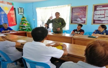 <p><strong>ANTI-INSURGENCY EFFORTS.</strong> First Lt. Adriano Muring Jr., commanding officer of the Alpha (Warriors) Company, 69th Infantry Battalion of the Philippine Army, discusses the government's anti-insurgency efforts with the local officials of Dingalan, Aurora during their meeting last October 16, 2019. The Barangay Development Council and Barangay Peace and Order Council of Barangays Butas na Bato and Davil-Davilan in Dingalan town have passed resolutions for the activation of the Barangay Task Force to End Local Communist Armed Conflict (BTF-ELCAC). <em>(File photo of the Army's 69th Infantry Battalion)</em></p>