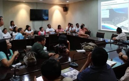 <p><strong>ADDRESSING SICOGON ISSUES.</strong> Iloilo Governor Artur Defensor Jr. (in peach colored polo, facing the screen) listens to the issues and concerns of local government officials of Carles town, property developer Ayala Land Inc., and residents and stakeholders in Sicogon Island on Monday (Oct. 22, 2019) during an ad hoc meeting at the Governor’s Boardroom. Defensor said he will visit the island to get the real situation as livelihood of locals had suffered from the suspension of development activities of Ayala Land. <em>(PNA photo by Gail Momblan)</em></p>