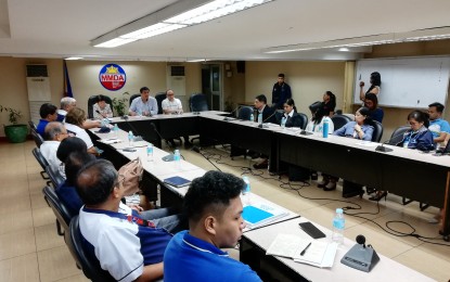 <p><strong>LATE MALL OPENING</strong>. MMDA general manager Arturo Garcia (middle of center table), other government officials, and representatives from malls and utility companies in Metro Manila discuss traffic measures to address the incoming surge of vehicles in the capital during the holiday season in a meeting at the MMDA headquarters in Makati City on Oct. 22. Among other agreements, the MMDA and mall owners agreed to reschedule their opening hours to 11 a.m. to ease the morning rush hours. <em>(Photo by Raymond Carl Dela Cruz)</em></p>
