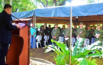 <p><strong>INTERFAITH SERVICE.</strong> Catholic priest Clifford Baira of the Archdiocese of Cotabato presides over the ecumenical service for peace and unity inside the Army's 6th Infantry Division (ID) in Barangay Awang, Datu Odin Sinsuat, Maguindanao on Monday (Oct. 21, 2019). The ecumenical service aims to seek guidance from the Almighty for a concerted effort to bring peace to the communities under the 6ID's area of responsibility in Central Mindanao. <em>(Photo courtesy of 6ID)</em></p>