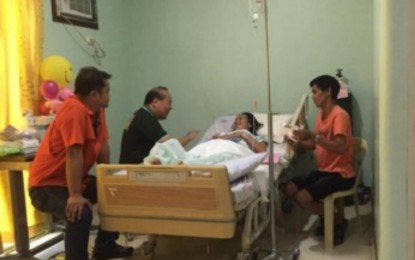 <p>PNA file photo of Zhydee Cabañelez inside a hospital in Valencia City, Bukidnon.</p>
