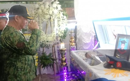 <p><strong>FINAL SALUTE.</strong> Brig. Gen. Angelito Casimiro, Cagayan Valley acting police regional director, pays respect with a salute for the late Patrolman Henry Gayaman, who was killed last Monday in a gun battle with New People's Army rebels in Burgos, San Guillermo, Isabela. Casimiro visited Gayaman's wake at the slain cop's family house in Aglipay, Quirino Province on Thursday (Oct. 24, 2019). <em>(Photo courtesy of Bobby Daguio)</em></p>