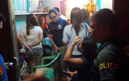 <p><strong>RESCUED.</strong> Operatives from the CIDG Iloilo City rescue 10 women from human traffickers in an operation in Mabolo village on Friday night (Oct. 25, 2018). Charges were filed against the two alleged pimps who are placed under police custody. <em>(Photo courtesy of CIDG 6)</em></p>