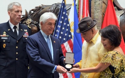 <p><strong>WWII VETERAN.</strong> Texas Rep. Roger Williams presents Jose Manzano-Somera, a former private in the Philippine Scouts of the US Army, with a Congressional Gold Medal during a ceremony at Fort Hood in Killeen, Texas on Friday (Oct. 25, 2019). Maj. Gen. Scott Efflandt, III Corps special assistant to the commanding general (far left) and the veteran's wife Elizabeth Manzano-Somera look on. <em>(Photo by Rosel L. Thayer/Stars and Stripes)</em></p>