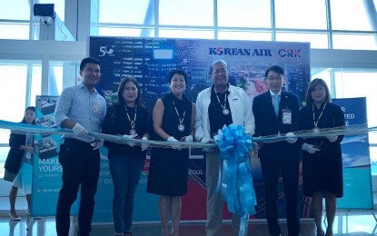 <p><strong>NEW CLARK-INCHEON ROUTE.</strong> Transportation Secretary Arthur Tugade leads the ribbon-cutting in welcoming Korean Air’s inaugural flight at Clark International Airport on Sunday (Oct. 26, 2019). Joining Tugade are Clark International Airport Corp President Joshua Bingcang, Department of Tourism Regional Director Carolina Uy, Lipad President and Ceo Bi Yong Chungunco, and Korean Air Regional Manager Cheol Lee. Korean Air will now be flying its Airbus A330 on a daily non-stop service between Incheon and Clark.<em> (Photo by Marna del Rosario)</em></p>