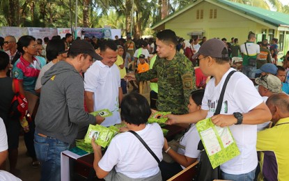 <p><strong>UNIFIED EFFORT.</strong> Various line agencies of the government, the local government unit, and private groups join hands to deliver basic services to the residents of Sitio Mabog in Barangay San Roque, Bislig City Saturday (Oct. 26, 2019). The service caravan benefited around 1,700 residents. <em>(Photo courtesy of 75IB)</em></p>
