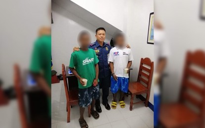<p><strong>SURRENDER.</strong> Lt. Col. Dennis C. Wenceslao, commander of the 1st Provincial Mobile Force Company of the Nueva Ecija Police Provincial Office, poses for a photo with two New People's Army (NPA) rebels who yielded to authorities in Nueva Ecija on Monday (Oct. 28, 2019). He said his immediate superior, NEPPO provincial director, Col. Leon Victor Rosete, is calling on the remaining NPA members to leave the terrorist group and rejoin the mainstream society.<em> (Photo courtesy of Lt. Col. Dennis C. Wenceslao)</em></p>