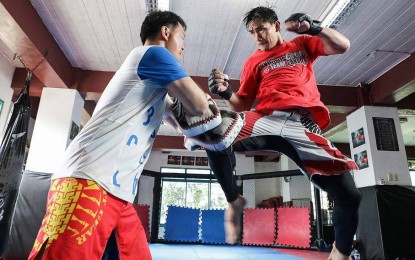 <p><strong>END 2019 WITH A BANG.</strong> Eduard Folayang in training with mentor Mark Sangiao at the Team Lakay gym in La Trinidad, Benguet before he faces a dangerous Amarsanaa Tsogookhuu at ONE Championship: Masters of Fate on Nov. 8, which serves as an undercard to stablemate Joshua Pacio, who will defend his strawweight title against Filipino Rene Catalan. <em>(Photo courtesy of ONE FC)</em></p>