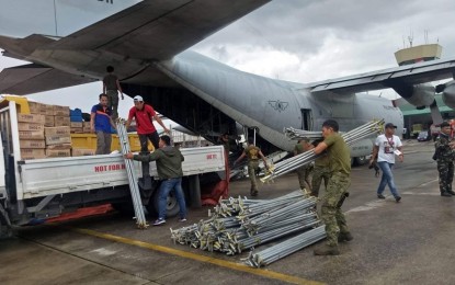 <p><strong>QUAKE RESPONSE.</strong> Philippine Air Force and Department of Social Welfare and Development 12 (Soccsksargen) personnel unload the additional emergency relief supplies for quake-hit areas that arrived at the General Santos City International Airport late Wednesday afternoon (Oct. 30, 2019). The supplies will be distributed to hardest-hit towns in North Cotabato. <em>(Photo courtesy of DSWD-12)</em></p>