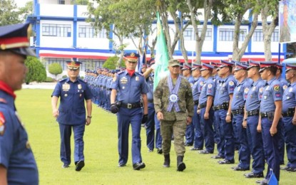 <p><strong>LEAVING WITH CONFIDENCE.</strong> The Police Regional Office in Western Visayas (PRO 6) renders retirement honors for Philippine Army's 3rd Infantry Division (3ID) commander, Maj. Gen. Dinoh Dolina on Tuesday afternoon (Oct. 30, 2019). Dolina, who is set to retire on Nov. 14, said that he is confident that insurgency problem in Western Visayas will be addressed through the government's whole-of-nation approach. <em>(Photo courtesy of Philippine Information Agency)</em></p>