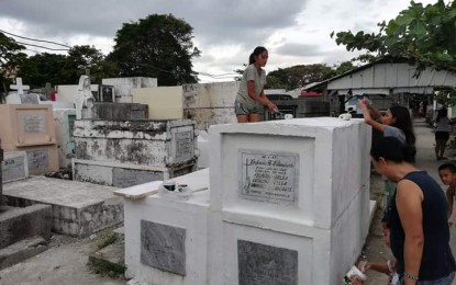 <p><strong>PAINTED.</strong> Tombs at the Tanza Cemetery in Barangay Tanza, City Proper in Iloilo City are repainted in time for the observance of All Saints' Day (Nov. 1, 2019) and All Souls' Day (Nov. 2, 2019). Tanza cemetery is the biggest public cemetery in Iloilo City. <em>(PNA photo by Perla G. Lena)</em></p>