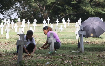<p><strong>DEPARTED LOVED ONES</strong>. Caretakers of the Libingan ng mga Bayani clean the tombs of our fallen heroes ahead of the observance of the All Saints Day and All Souls Day, on Monday (Oct. 28, 2019). November 1 and 2 have been declared as special non-working days under Proclamation No. 555, series of 2018, issued by President Rodrigo Duterte, to strengthen family ties by providing more time to observe their most cherished tradition of visiting loved ones during the period. <em>(PNA Photo by Avito C. Dalan)</em></p>