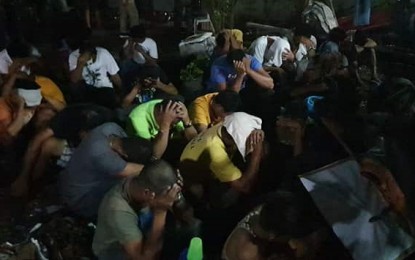 <p><strong>RAID.</strong> Some of those apprehended during the search warrant operation of police and military operatives at the Kilusang Mayo Uno office in Bacolod City late Thursday afternoon (Oct. 31, 2019). The simultaneous raids in the offices of progressive groups led to the arrest of 62 persons, including minors, and the recovery of firearms and a hand grenade.<em> (Photo courtesy of Adrian Bobe)</em></p>