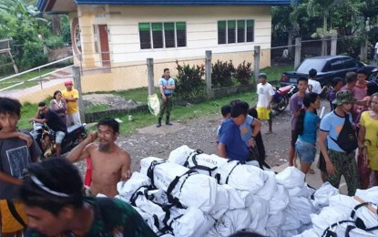 <p><strong>ASSISTANCE.</strong> Office of the Civil Defense in Region 11 (OCD 11) distributes temporary shelter tarps and shelter kits to displaced residents in Barangay Upper Bala, Magsaysay, Davao del Sur on Friday (Nov. 1, 2019). The said barangay was greatly affected by the 6.3, 6.6, and 6.5-magnitude earthquakes which hit the province recently. <em>(Photo from OCD 11 Facebook Page)</em></p>
