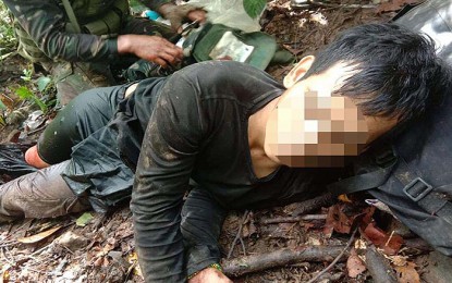 <p><strong>YOUNG REBEL.</strong> "Kent", a young NPA rebel, is provided with first aid by 29th IB soldiers at the encounter site in Santiago, Agusan del Norte after he was abandoned by his comrades following a clash with government troops. The armed encounter occurred in Barangay San Isidro, Santiago town in Agusan del Norte on Saturday (Nov. 2, 2019). <em>(Photo courtesy of CMO, 29IB, PA)</em></p>