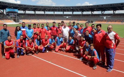 <p><strong>ATHLETICS STADIUM.</strong> Members of the Philippine athletics team pose for photo opportunity inside the Athletics Stadium of the New Clark City Sports Hub. The 20,000-seater world class facility will host the athletics competition of the 30th Southeast Asian Games from Nov. 30 to Dec. 11 this year. <em>(contributed photo)</em></p>