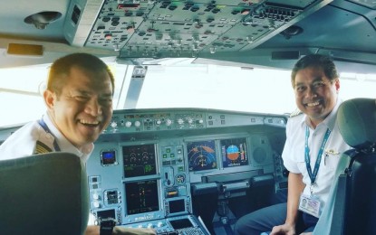 <p><strong>LOOKING FOR ASPIRING PILOTS.</strong> Cebu Pacific (CEB) vice president for Flight Operations Samuel Avila (left) shares a light moment with CEB pilot, Manny Ilagan, inside the cockpit. The budget airline is currently looking for the ninth batch of aspiring pilots for its Cadet Pilot Training Program. <em>(Photo courtesy of Samuel Avila)</em></p>
