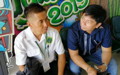<p><strong>COLLABORATION.</strong> Quarantine Officer, Dr. Alfonso Tundag of the Bureau of Animal Industry in Negros Oriental (left) and Warren Cadeliña of the National Meat Inspection Service in Region 7 are continuously monitoring the entry of raw pork and other pork meat by-products from Manila to prevent the entry of the African Swine Fever virus to the province. Their team confiscated frozen pork products from a passenger from Manila that arrived at the Dumaguete airport on Monday (Nov. 4, 2019). <em>(Photo by Judy Flores Partlow)</em></p>