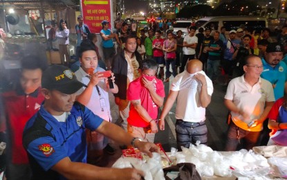 <p><strong>PASAY SHABU HAUL.</strong> Members of the PNP Drug Enforcement Group inspect PHP36 million worth of shabu seized from two suspects in a buy-bust operation in Pasay City on Monday (Nov. 4, 2019). The suspects are set to face charges for violation of Republic Act 9165 or the Comprehensive Dangerous Drugs Act. <em>(Photo courtesy of PNP-DEG)</em></p>