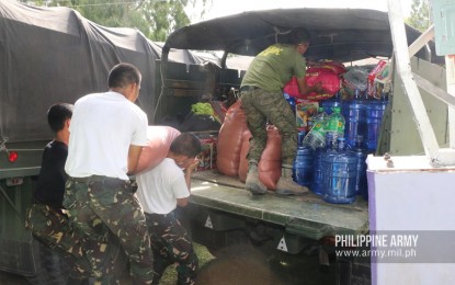 <p><strong>DONATION TO QUAKE VICTIMS.</strong> Army troops unload relief goods to be distributed to earthquake victims in Cotabato and other areas in Mindanao on Tuesday (Nov. 5, 2019). Aside from assisting in relief operations, the soldiers will give part of their subsistence allowance for the month of November to quake victims. <em>(Photo courtesy of the Army Chief Public Affairs Office)</em></p>