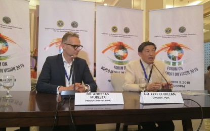<p><strong>EYE CARE.</strong> WHO Regional Adviser for Blindness, Dr. Andreas Mueller (left), and PERI Director, Dr. Leo Cubillan (right), explain the 2019 World Report on Vision in Manila on Tuesday (Nov. 5, 2019). The report focused on comprehensive eye care services and the need to integrate eye care within the PH health systems. <em>(Photo by Lade Kabagani/PNA)</em></p>