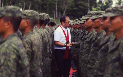 <p><strong>GRADUATES</strong>. Presidential Peace Adviser Carlito G. Galvez, Jr. congratulates KAPATIRAN members who completed a 45-day Community Defense Unit (CDU) training in Camp General Macario Peralty, Jr. in Jamindan, Capiz on Nov. 5, 2019. A total of 266 members of the KAPATIRAN, a rejectionist group of the Communist Party of Philippines and New People's Army (CPP-NPA), finished the training. <em>(Photo courtesy of OPAPP)</em></p>