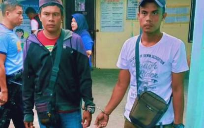 <p><strong>ARRESTED.</strong> Police authorities nab two alleged members of the Moro Islamic Liberation Front found carrying unlicensed firearms, at a local fish port on Jose Lim Sr. Street, Barangay Poblacion Mother, Cotabato City on Tuesday (Nov. 5, 2019). Also seized from the two were identification cards indicating their affiliation with the Moro Islamic Liberation Front 105th base command in Maguindanao. <em>(Photo courtesy of Brigada News FM Cotabato)</em></p>