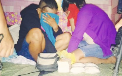 <p><strong>HIGH-VALUE TARGET.</strong> Department store saleslady Edelyn Cabarse (right), 34, and her cohort, Jona Gonzales, 41, a 'habal-habal' driver, were arrested in a buy-bust operation in Sitio Cogon, Labangon village, Cebu City on Tuesday afternoon (Nov. 5, 2019). Milva Mojado, Cebu provincial officer of the Philippine Drug Enforcement Agency in Central Visayas, said confiscated from the duo was 400 grams of shabu worth P2.7 million. <em>(Contributed photo)</em></p>