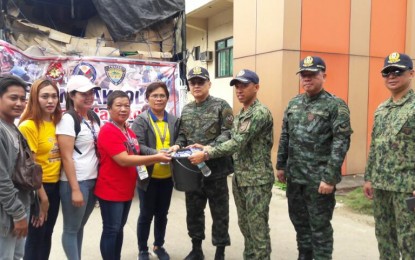 <p><strong>AID TO QUAKE VICTIMS.</strong> PNP officer in charge, Lt. Gen. Archie Gamboa (4th from right) leads the turnover of donations from police personnel to victims of the recent earthquakes in Makilala, North Cotabato on Wednesday (Nov. 6, 2019). The relief items include food, water and tents, among others. <em>(Photo courtesy of PNP Public Information Office)</em></p>