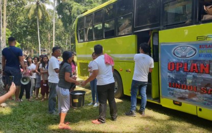 <p>Volunteers for the Bacolod City-based Vallacar Transit Inc. (VTI) distribute relief goods to quake victims housed at the Boy Scouts Camp in Barangay Old Bulatulan Makilala, North Cotabato. <em>(PNA photos by Allan Nawal)</em></p>