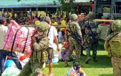 <p><strong>OPPORTUNE TIME.</strong> Soldiers of the Army’s 7th Infantry Battalion unload relief goods to quake victims in Matalam, North Cotabato, on Thursday (Nov. 7, 2019). At about the same time, two communist rebels approached the soldiers to inform them of their desire to surrender. <em>(Photo courtesy of 7IB)</em></p>