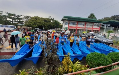 <p><strong>FISHING BOATS</strong>. Target beneficiaries receive their fiberglass fishing boats during a turnover ceremony held at the Binirayan Gym in San Jose de Buenavista, Antique on Thursday (Nov. 7, 2019). The fiberglass fishing boats from the Bureau of Fisheries and Aquatic Resources were part of the commitment of former agriculture secretary Manny Piñol when he visited Antique in 2017. <em>(PNA photo by Annabel Consuelo J. Petinglay)</em></p>