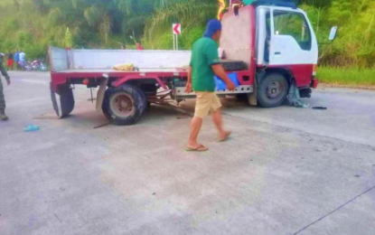 <p><strong>ROAD MISHAP.</strong> The ill-fated Isuzu cargo truck that carried more than 25 persons en route to Lebak, Sultan Kudarat from Datu Odin Sinsuat, Maguindanao, rests in the middle of the highway after losing its brakes and hitting a road railing on Friday (Nov. 8, 2019). Two died while 24 others were injured in the accident. <em>(Photo courtesy of South Upi MPS)</em></p>