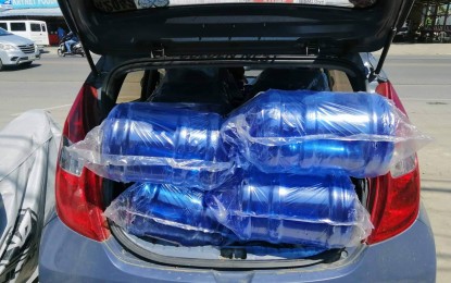<p><strong>WATER FOR QUAKE VICTIMS</strong>. Water containers donated by well-meaning citizens of Cagayan de Oro City are loaded into a vehicle for eventual transport to the south-central areas of Mindanao that were devastated by the recent series of earthquakes. A group called "Team CDO" on Sunday (Nov. 10, 2019) prepared consolidated donations to be brought to the victims. <em>(Contributed photo)</em></p>